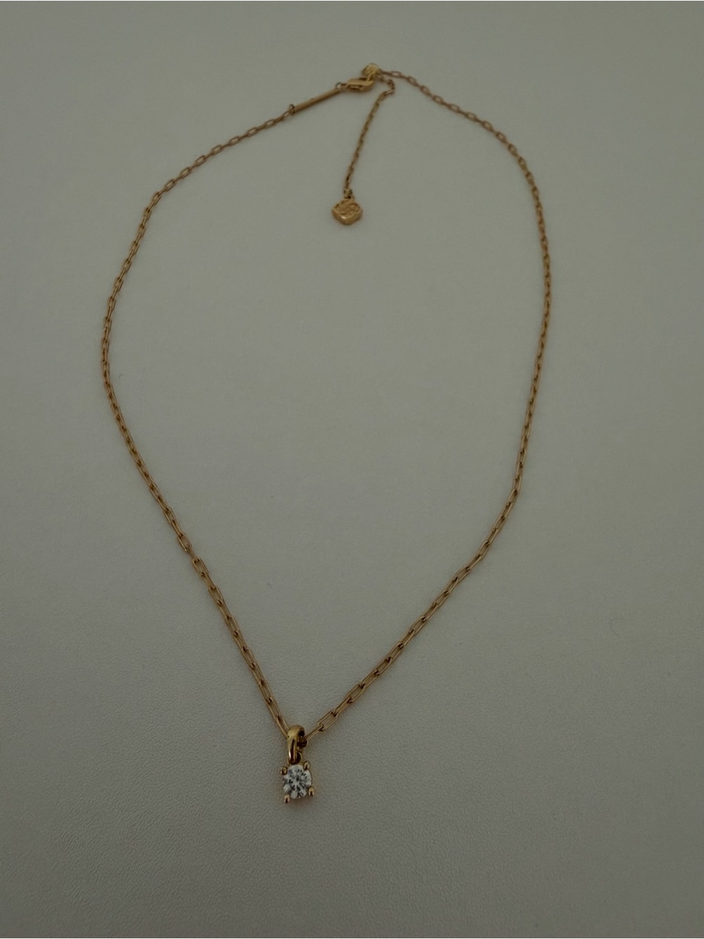 Kendra Scott gold chain necklace with small diamond pendant